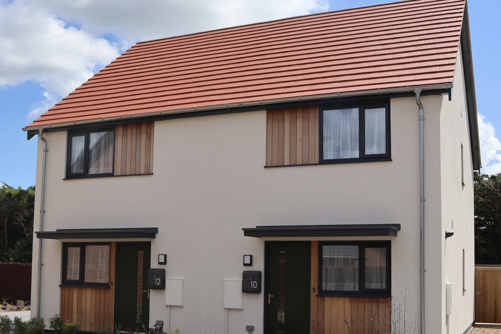 Planum Concrete roof tiles finished in Cayenne Red